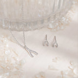 Theia Wishbone Studs.